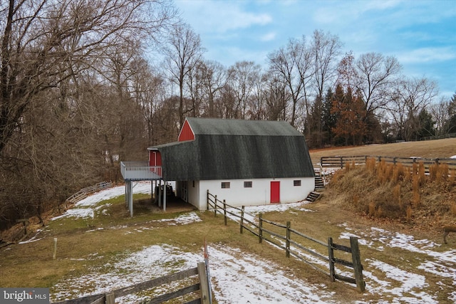 snow covered property featuring a rural view