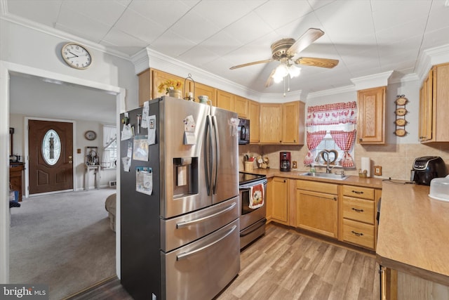 kitchen with stainless steel appliances, sink, ornamental molding, decorative backsplash, and light colored carpet