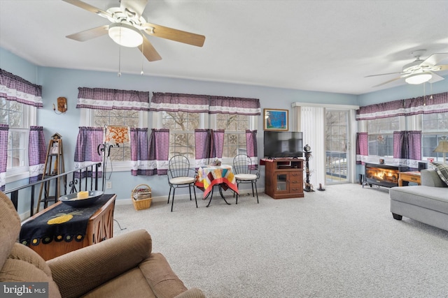 living room with carpet floors and ceiling fan