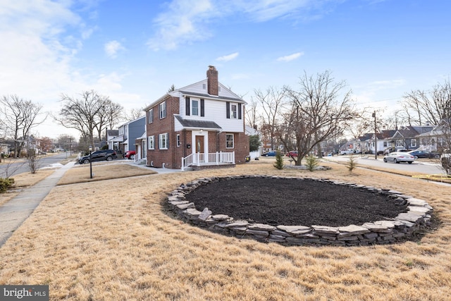 view of side of home featuring a lawn