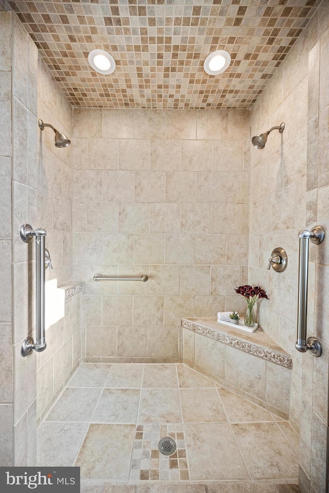 bathroom with tiled shower