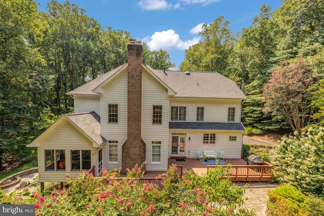 back of house featuring a deck