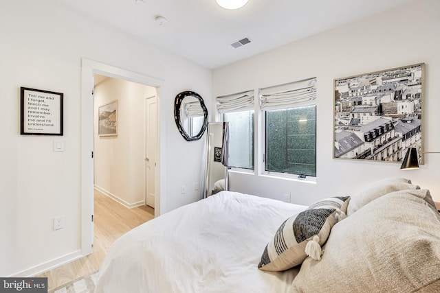 bedroom with light wood-type flooring