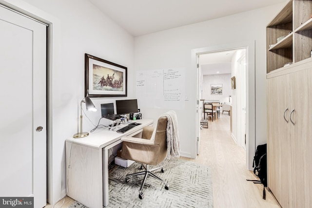 office space with light hardwood / wood-style floors