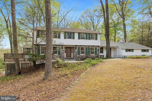 colonial home with a deck