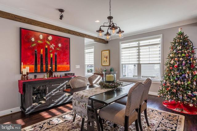 dining space with a chandelier, crown molding, and hardwood / wood-style flooring