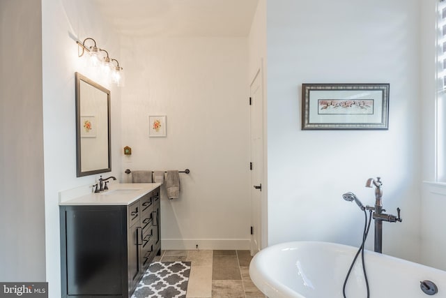 bathroom with vanity and a bathing tub