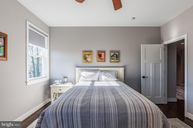 bedroom featuring ceiling fan and dark hardwood / wood-style flooring