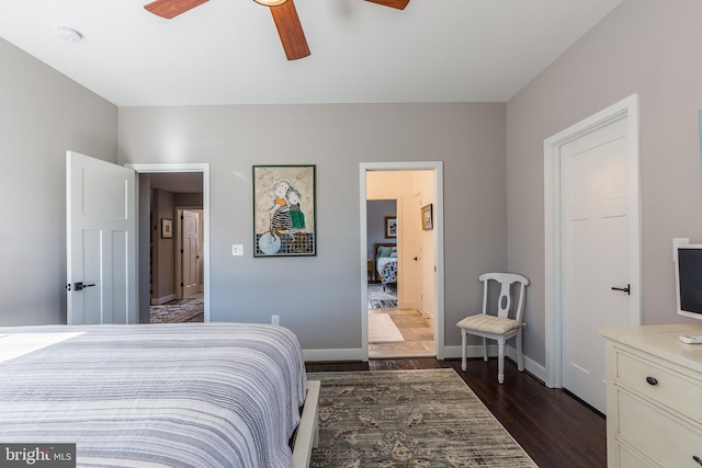 bedroom with ceiling fan and dark hardwood / wood-style floors