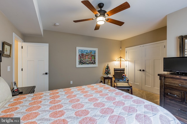 bedroom with ceiling fan, a closet, and carpet