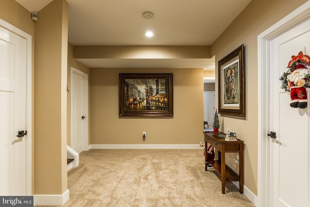 hallway with light carpet