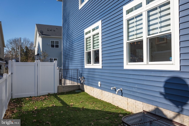 view of home's exterior with a yard