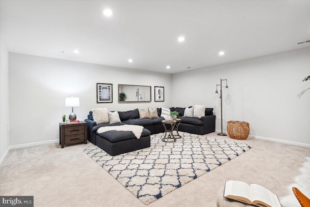 living room featuring baseboards, carpet, visible vents, and recessed lighting