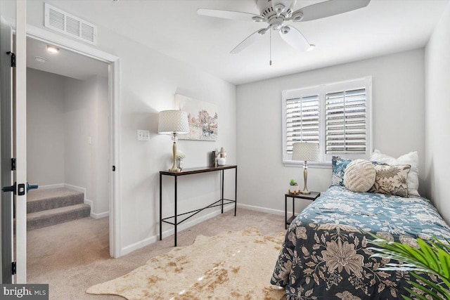 bedroom with visible vents, baseboards, a ceiling fan, and carpet flooring