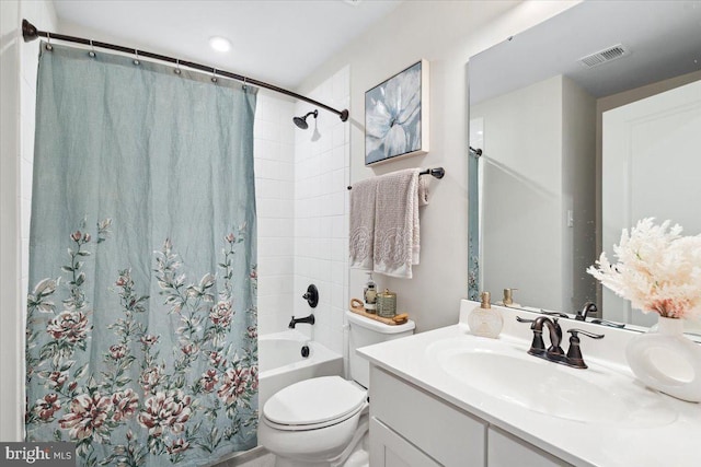 full bathroom with visible vents, toilet, shower / bath combo with shower curtain, and vanity