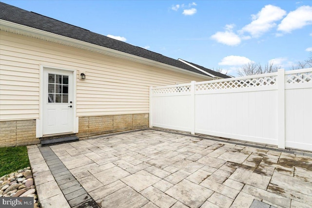 view of patio / terrace featuring fence