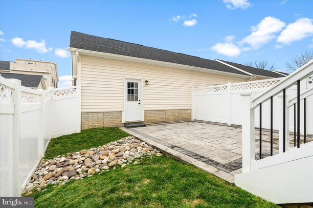 back of house with a patio and a fenced backyard