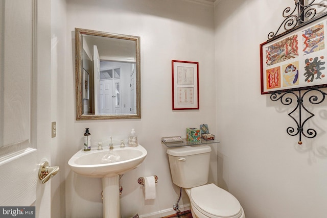 bathroom with toilet and sink