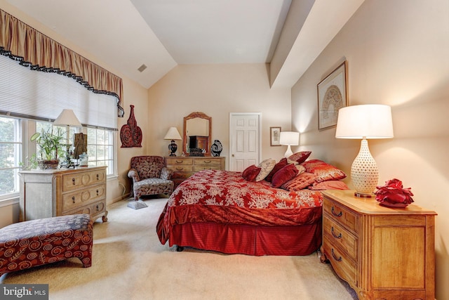 carpeted bedroom featuring lofted ceiling