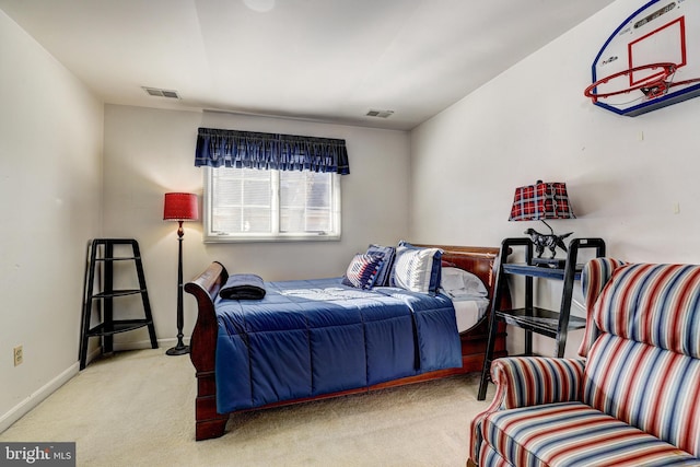 bedroom with light colored carpet