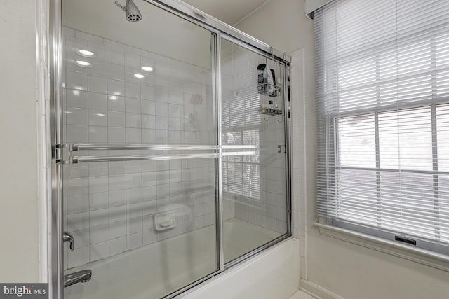 bathroom with tile patterned floors and enclosed tub / shower combo