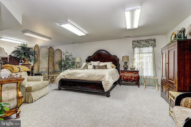 bedroom featuring light colored carpet