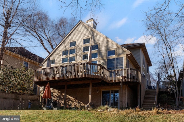 rear view of house with a wooden deck