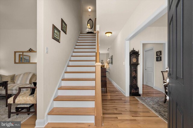 staircase featuring hardwood / wood-style floors