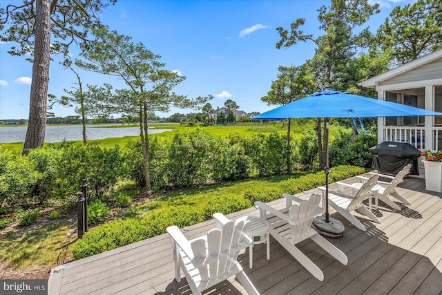 deck featuring grilling area and a water view