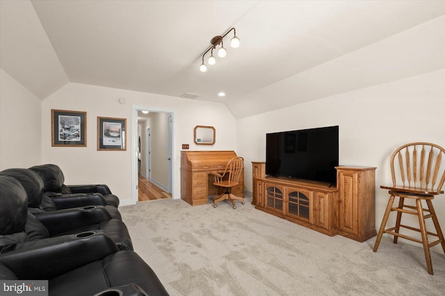 living room featuring light carpet and lofted ceiling