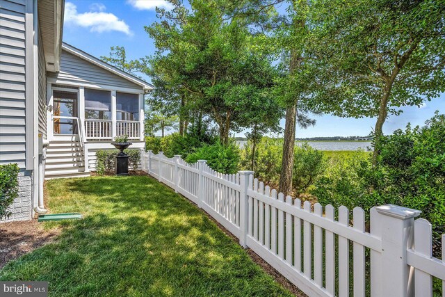 view of yard with a sunroom