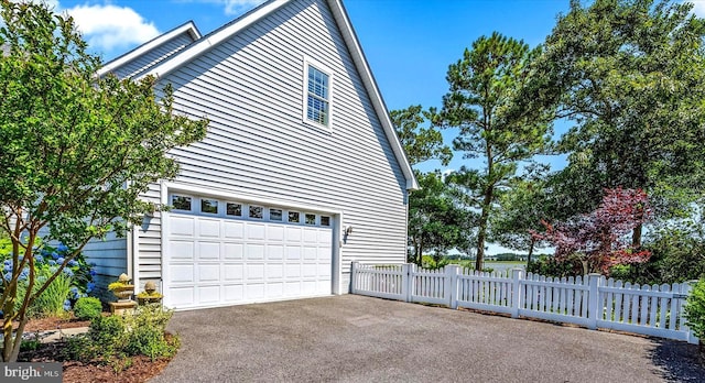 view of side of property featuring a garage