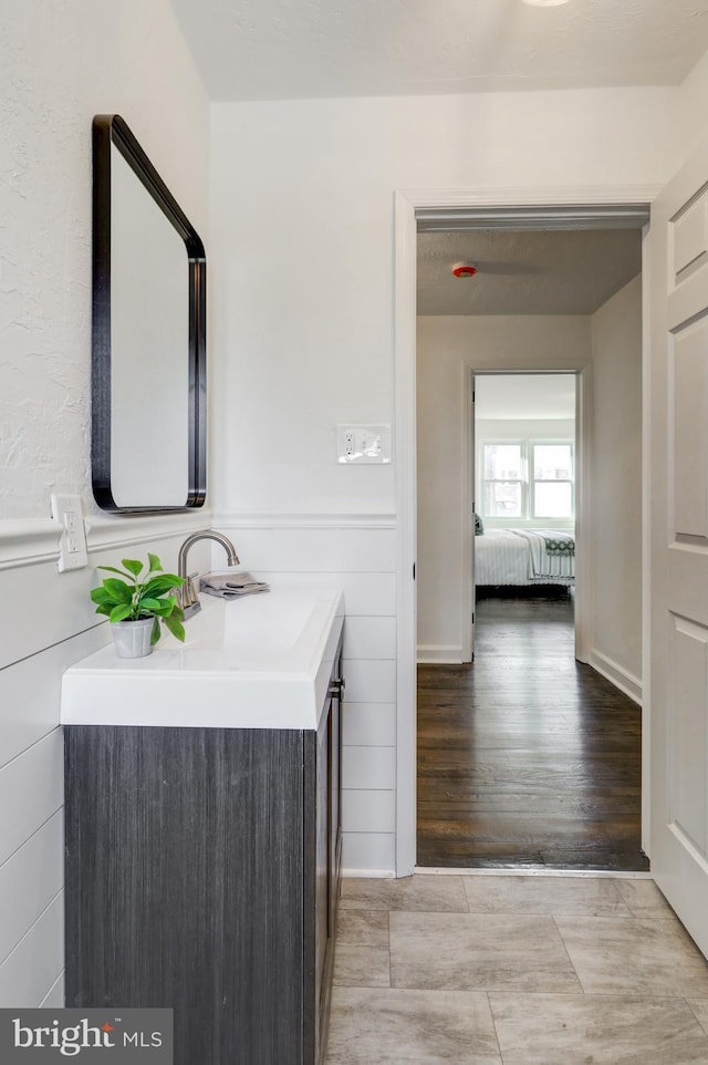 bathroom with wood-type flooring and vanity