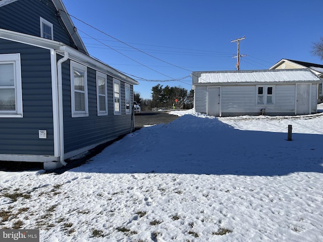 view of yard layered in snow