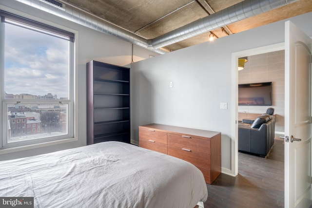 bedroom featuring dark hardwood / wood-style flooring