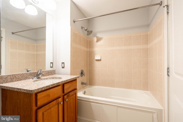 bathroom featuring vanity and tiled shower / bath combo