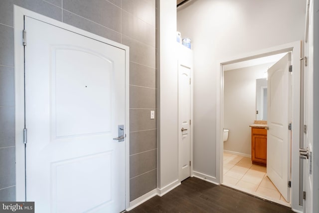 entryway with dark wood-type flooring