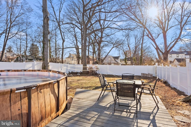 wooden terrace with a pool