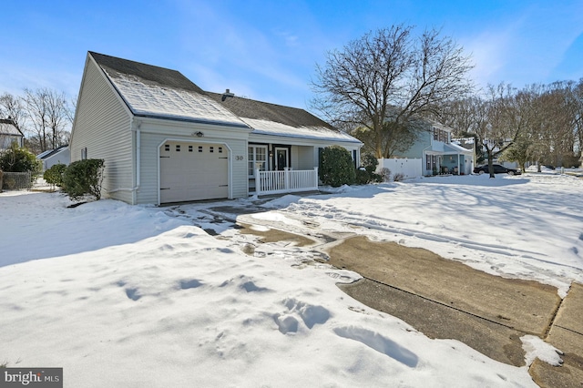 view of front facade featuring covered porch and a garage