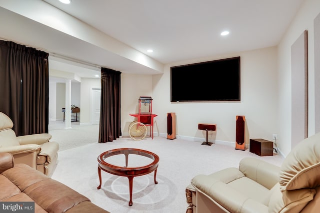 living room with recessed lighting, ornate columns, light colored carpet, and baseboards