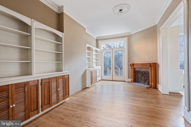 unfurnished living room featuring light hardwood / wood-style floors and ornamental molding