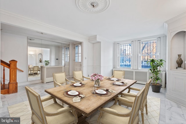 dining room featuring ornamental molding