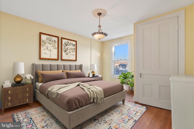 bedroom with hardwood / wood-style flooring