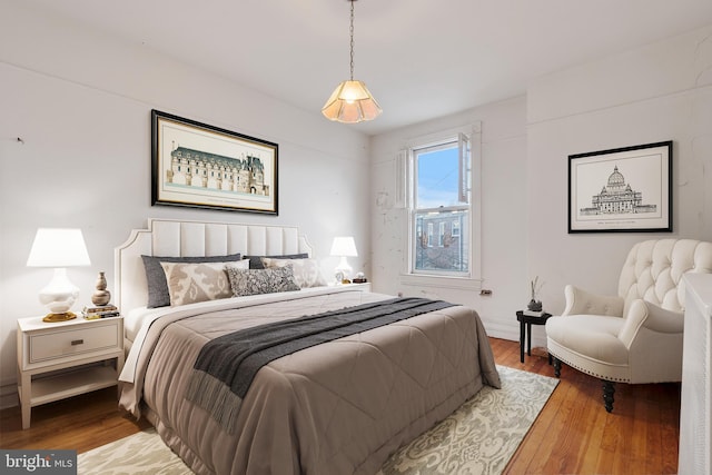 bedroom featuring wood-type flooring