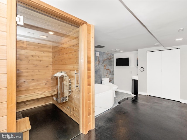 view of sauna / steam room with concrete flooring