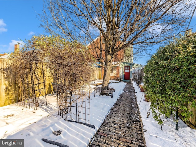 view of yard layered in snow