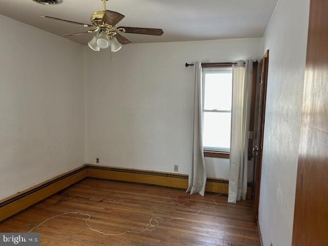 unfurnished room featuring hardwood / wood-style flooring and ceiling fan