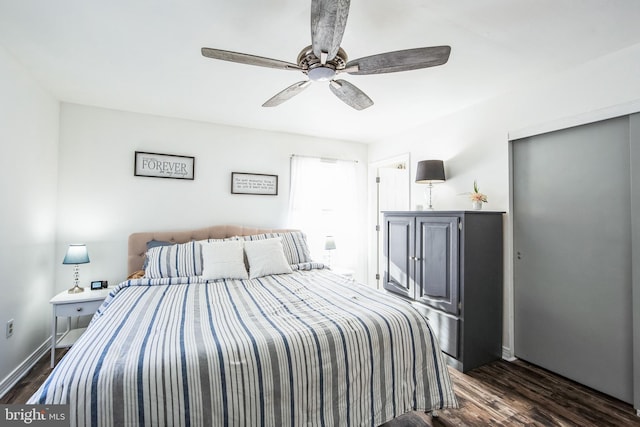 bedroom with dark wood-type flooring and ceiling fan