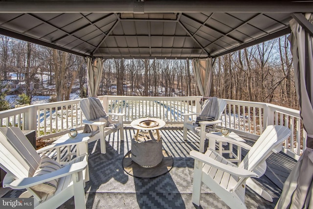 snow covered deck featuring a gazebo