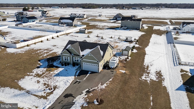 snowy aerial view with a rural view